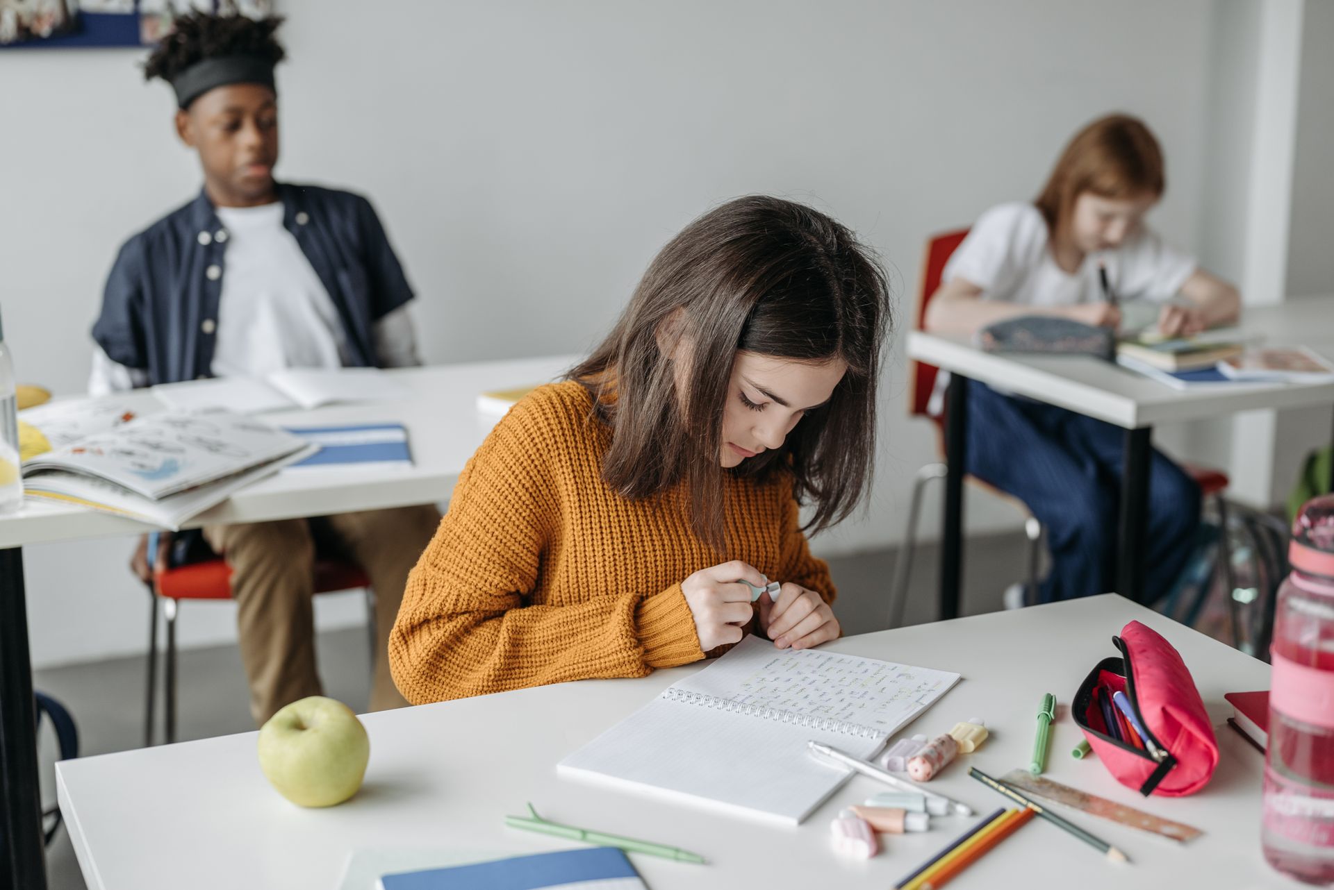 Student studying at a desk with KStudy